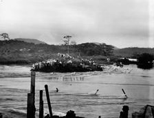 First rush of water through Gamboa dyke, Panama Canal, c.between 1910 and 1914. Creator: Unknown