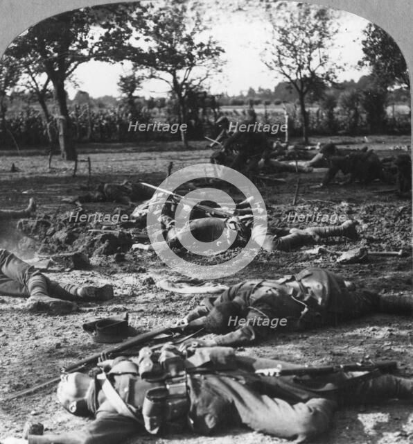 First World War battlefield scene, c1914-c1918. Artist: Realistic Travels Publishers