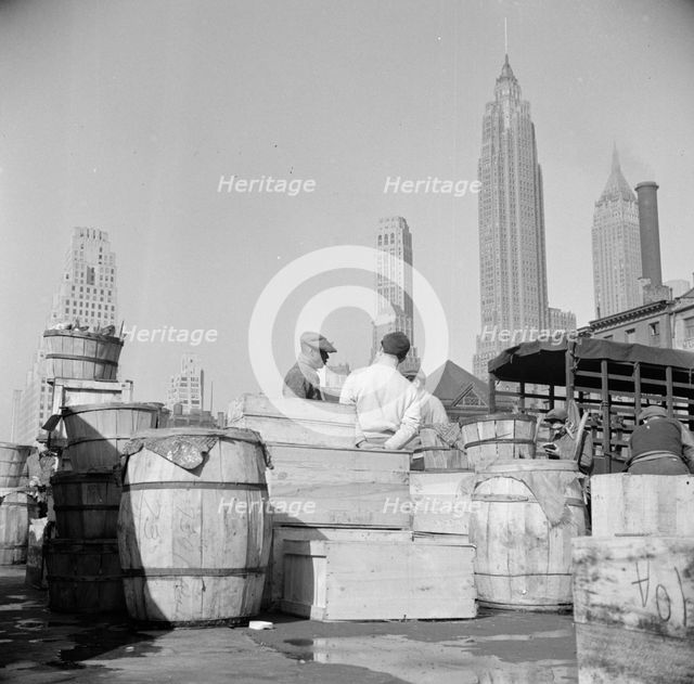 Fish caught off the New England coast is packed in these barrels and boxes and..., New York, 1943. Creator: Gordon Parks.