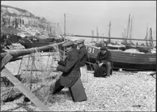 Fishermen mending nets on the beach, Hastings, East Sussex, 1925-1939. Creator: J Dixon Scott