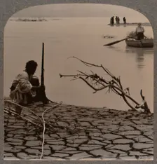 Fishermen by the Dead Sea: showing cracks on shore c1900