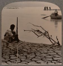 Fishermen by the Dead Sea: showing cracks on shore c1900