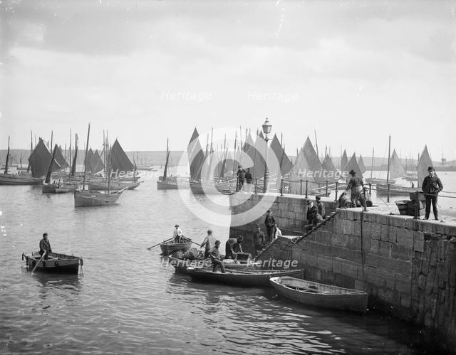 Fishermen unload their catches, Falmouth Pier, Falmouth, Cornwall, c1860-c1922. Artist: Henry Taunt