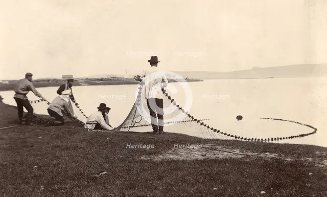 Fishermen with a net in their hands, 1900. Creators: I. A. Podgorbunskii, V. I. Podgorbunskii.