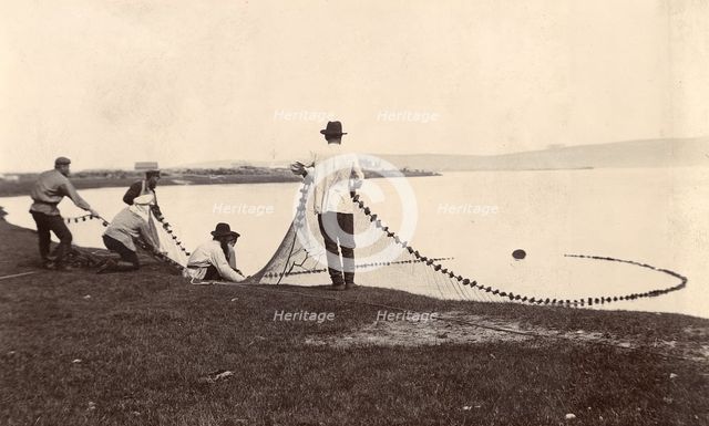 Fishermen with a net in their hands, 1900. Creators: I. A. Podgorbunskii, V. I. Podgorbunskii.