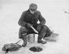 Fishing thru ice, between c1910 and c1915. Creator: Bain News Service