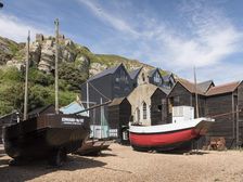 Fishing boats and net shops, Stade Beach, Hastings, East Sussex, c2010s. Creator: Steven Baker