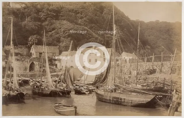 Fishing boats in the harbour at Clovelly, seen from the Pier, with the Red Lion Hotel..., c1885. Creator: James Valentine.
