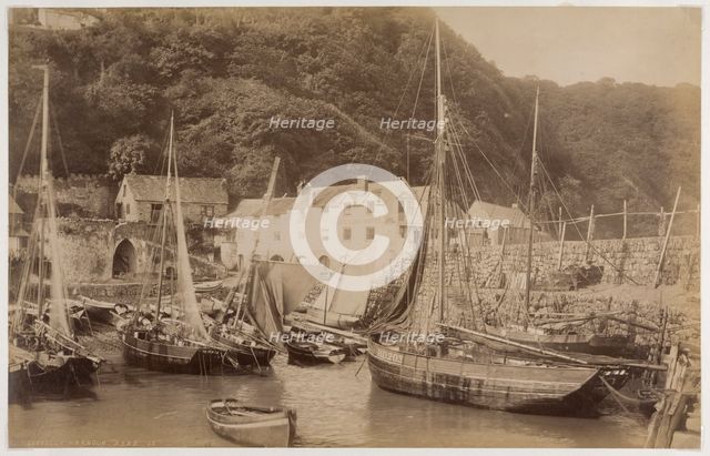 Fishing boats in the harbour at Clovelly, seen from the Pier, with the Red Lion Hotel..., c1885. Creator: James Valentine.