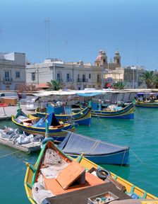 Fishing boats in the harbour, Marsaxlokk, Malta. Creator: Peter Thompson
