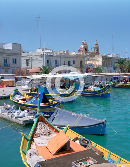 Fishing boats in the harbour, Marsaxlokk, Malta.  Creator: Peter Thompson.