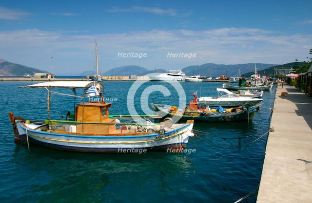 Fishing boats moored alongside the quay, Sami, Kefalonia, Greece. Creator: Peter Thompson.