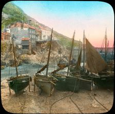 Fishing fleet at low tide, Polperro, Cornwall, late 19th or early 20th century. Artist: Church Army Lantern Department