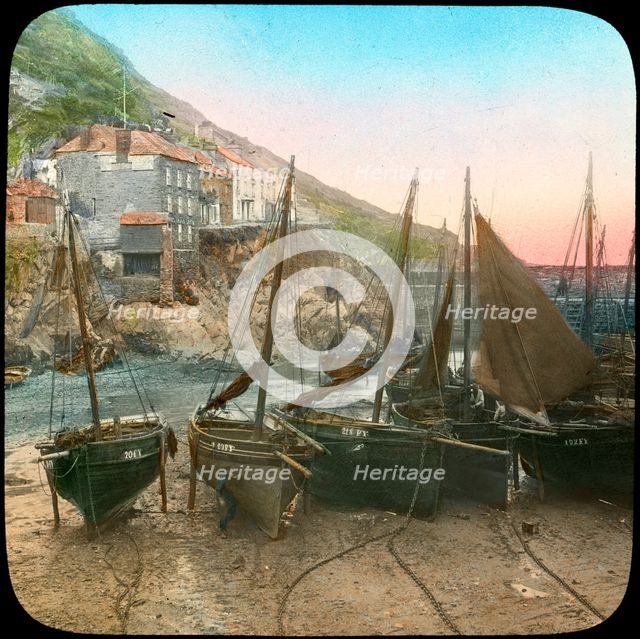 Fishing fleet at low tide, Polperro, Cornwall, late 19th or early 20th century. Artist: Church Army Lantern Department
