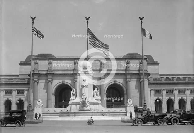 Flags - American, British, And French Flags in Front of Union Station, Awaiting Arrival..., 1917. Creator: Harris & Ewing.