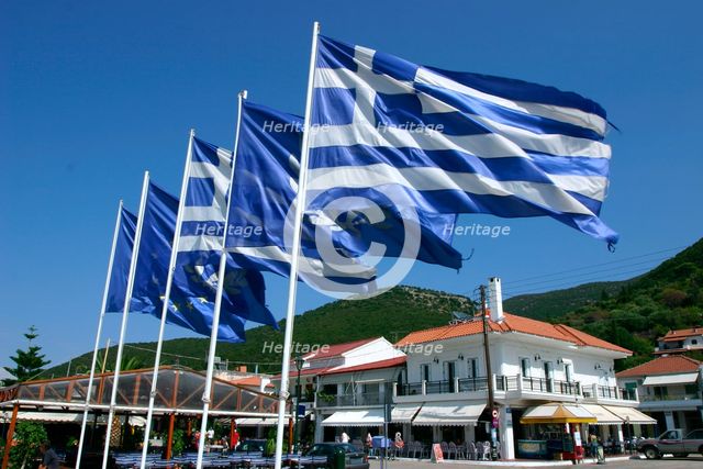 Flags on the quayside, Sami, Kefalonia, Greece. Creator: Peter Thompson.