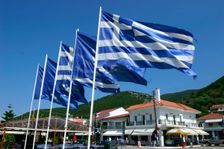 Flags on the quayside, Sami, Kefalonia, Greece. Creator: Peter Thompson