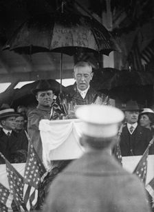 Flag Day - Wilson Making Address in Rain. Lansing 2nd from Right, 1917. Creator: Harris & Ewing