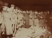 Flashlight - Jap soldiers at Chemulpo, after naval battle, standing around bonfire, c1904. Creator: Robert Lee Dunn