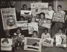 Flatbush art students showing examples of their work, 1935. Creator: Unknown