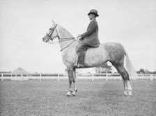 Fletcher, Mr., on a horse, 1933 July. Creator: Arnold Genthe