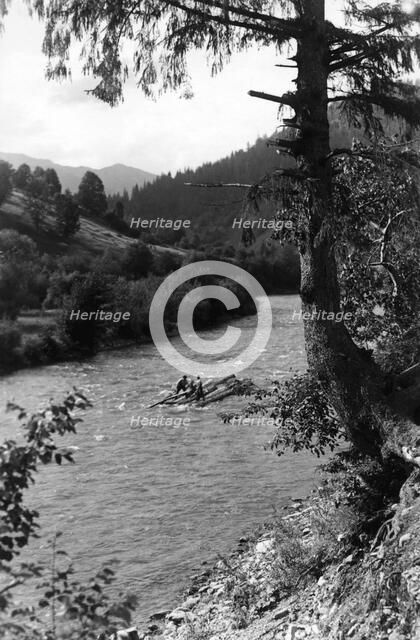 Floating tree trunks down the river, Bistrita Valley, Moldavia, north-east Romania, c1920-c1945. Artist: Adolph Chevalier