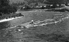 Floating tree trunks down the river, Bistrita Valley, Moldavia, north-east Romania, c1920-c1945. Artist: Adolph Chevalier