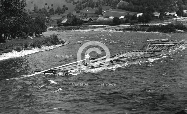 Floating tree trunks down the river, Bistrita Valley, Moldavia, north-east Romania, c1920-c1945. Artist: Adolph Chevalier