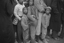 Flood refugees at mealtime, Forrest City, Arkansas, 1937. Creator: Walker Evans