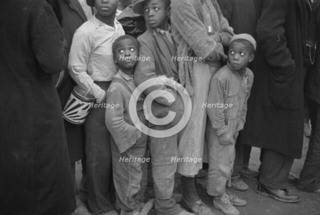 Flood refugees at mealtime, Forrest City, Arkansas, 1937. Creator: Walker Evans.