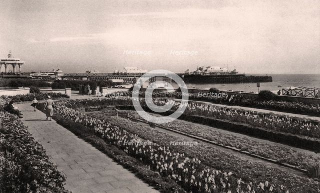 Floral gardens and the West Pier, Brighton, Sussex, 1938. Artist: Unknown