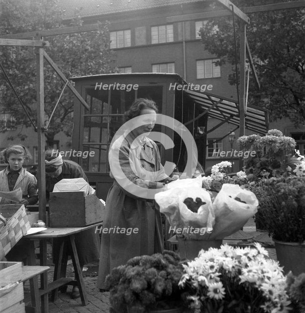Flower stall in the market, Malmö, Sweden, 1947. Creator: Otto Ohm.