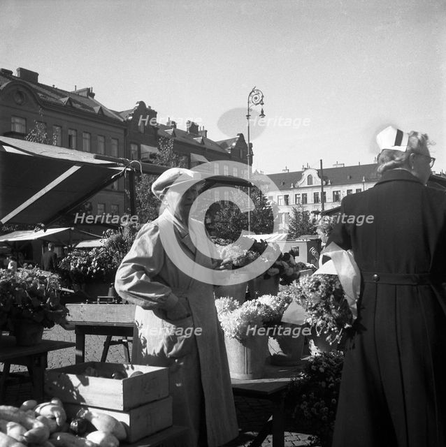 Flower stall in the market, Malmö, Sweden, 1947. Creator: Otto Ohm.