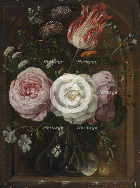 Flower still life with a tulip and roses in a glass vase.