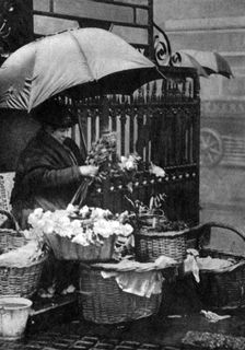 Flower seller, Piccadilly Circus, London, 1926-1927