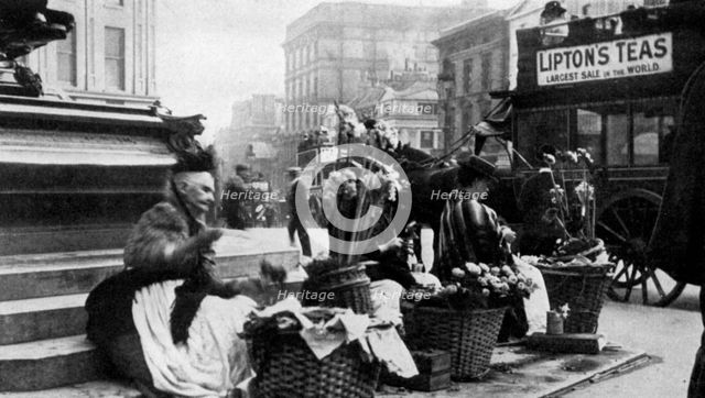 Flower sellers at Piccadilly Circus, London, 1901 (1951). Artist: Unknown