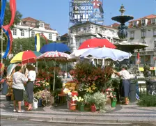 Flower sellers in the Rossio, Lisbon, Portugal. Creator: Peter Thompson
