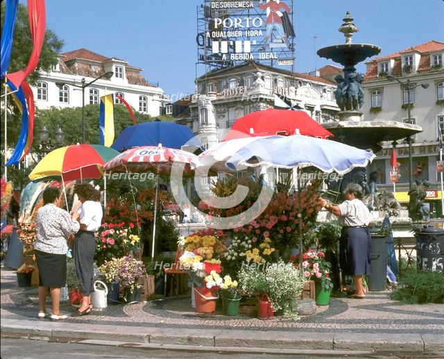Flower sellers in the Rossio, Lisbon, Portugal.  Creator: Peter Thompson.