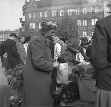 Fruit and vegetable stall in the market, Malmö, Sweden, 1947. Creator: Otto Ohm