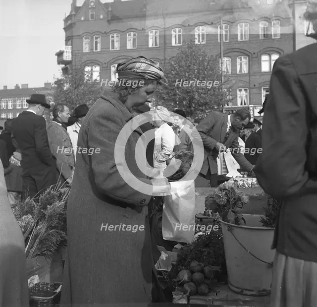 Fruit and vegetable stall in the market, Malmö, Sweden, 1947. Creator: Otto Ohm.