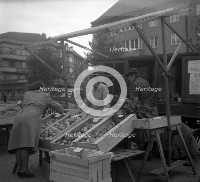 Fruit and vegetable stall in the market, Malmö, Sweden, 1947. Creator: Otto Ohm.