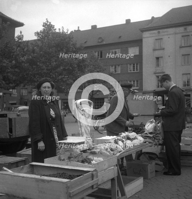 Fruit and vegetable stall in the market, Malmö, Sweden, 1947. Creator: Otto Ohm.