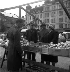 Fruit and vegetable stall in the market, Malmö, Sweden, 1947. Creator: Otto Ohm