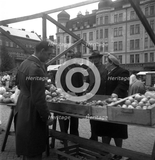 Fruit and vegetable stall in the market, Malmö, Sweden, 1947. Creator: Otto Ohm.