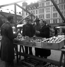 Fruit and vegetable stall in the market, Malmö, Sweden, 1947. Creator: Otto Ohm