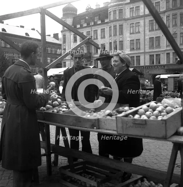 Fruit and vegetable stall in the market, Malmö, Sweden, 1947. Creator: Otto Ohm.