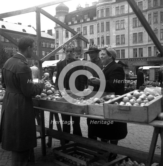 Fruit and vegetable stall in the market, Malmö, Sweden, 1947. Creator: Otto Ohm.