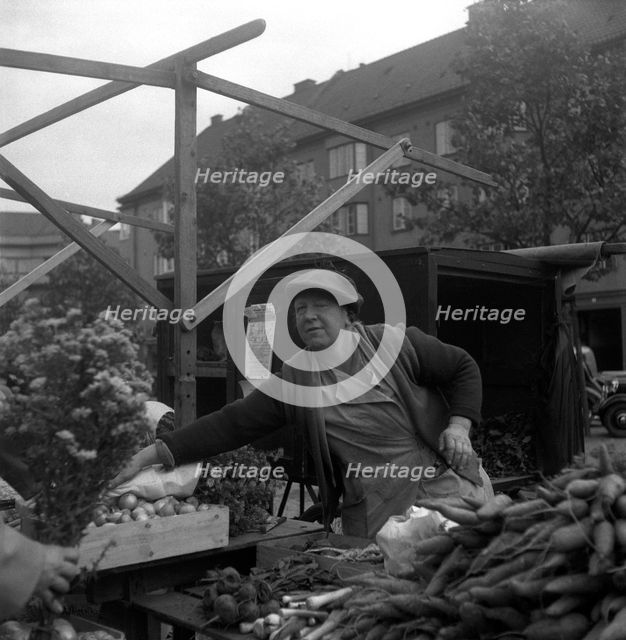 Fruit and vegetable stall in the market, Malmö, Sweden, 1947. Creator: Otto Ohm.