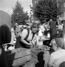 Fruit and vegetable stall in the market, Malmö, Sweden, 1947. Creator: Otto Ohm