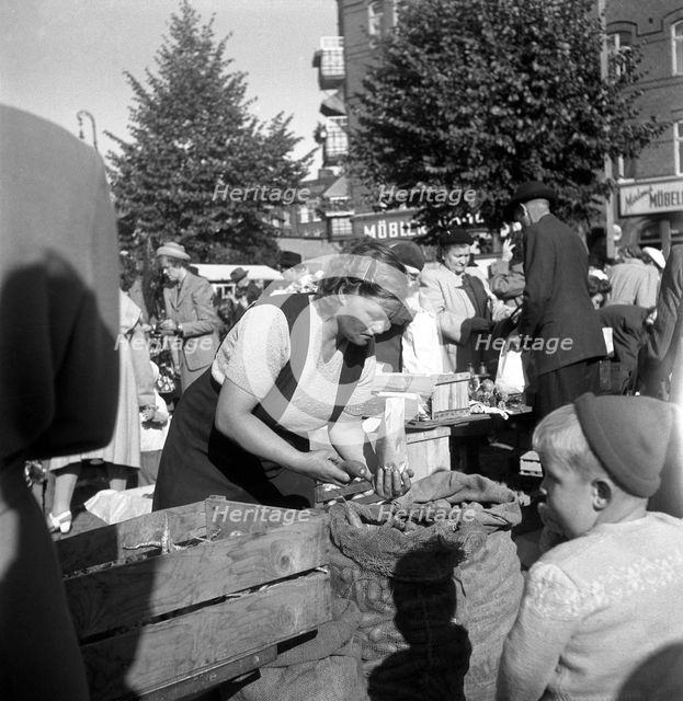 Fruit and vegetable stall in the market, Malmö, Sweden, 1947. Creator: Otto Ohm.